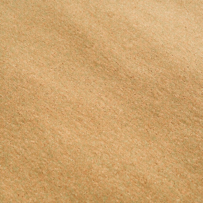 A close-up view of a natural cork yoga mat surface fills the whole ...