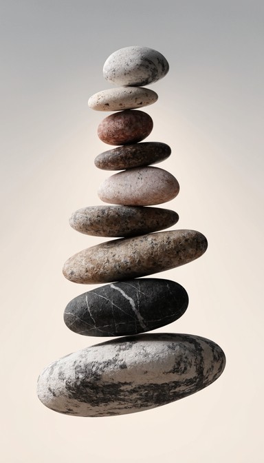 Smooth zen stones stacked in perfect vertical balance create a peaceful ...
