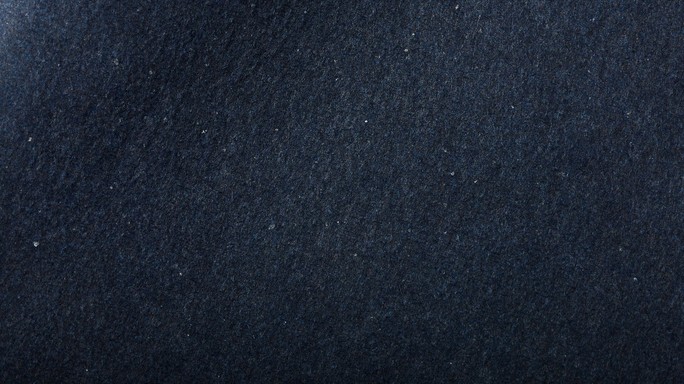 Deep navy blue handmade paper texture with tiny silver specks that ...