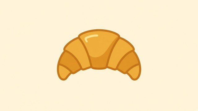 A single golden croissant sits in the middle of a soft, warm cream ...